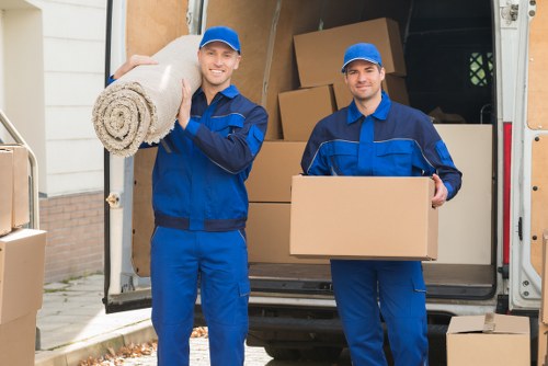 Packed moving boxes and furniture ready for local house removals