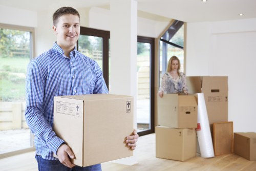 Packed moving boxes and furniture loaded for transport