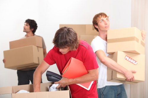 Office furniture and equipment being loaded for commercial removals