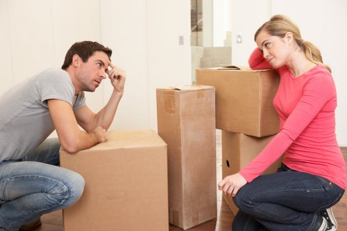 Professional movers loading furniture and boxes for a house move