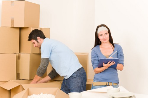 Local movers transporting household items from a New Addington property