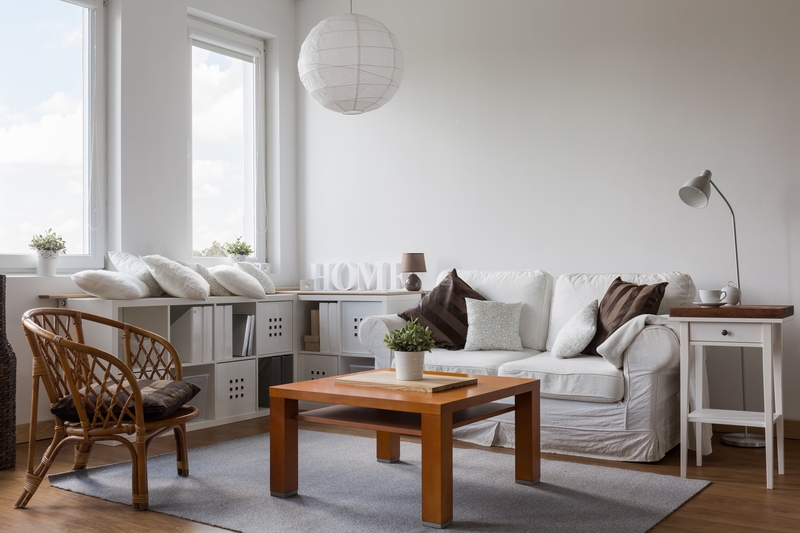 Professional movers carrying furniture from a New Addington home